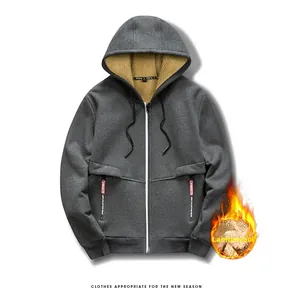 Detail of dark grey zip-up hoodie featuring warm sherpa fleece lining and white zipper