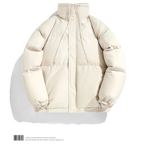 Detail of beige quilted puffer jacket showing high neck drawstring and windproof fabric