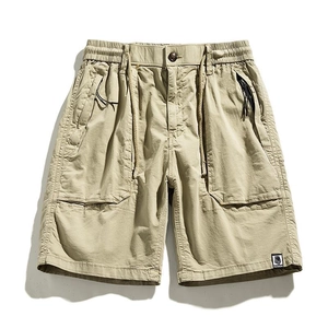 Men's khaki cargo shorts with large patch pockets and adjustable drawstring waist