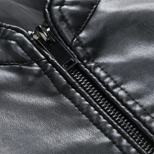 Close-up of black biker jacket with stand collar and metallic zipper detail