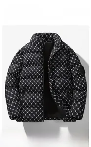 Detail of windproof puffer jacket featuring all-over B-letter monogram and brand sleeve patch