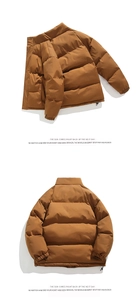 Detail view of caramel brown puffer jacket with quilted padding and elastic cuffs