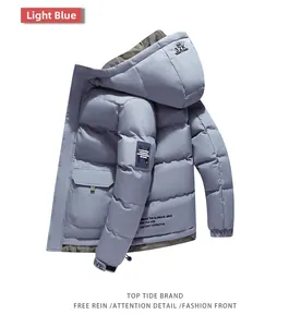 Detail view of light blue hooded puffer jacket with camouflage lining and street style print
