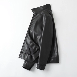 Detail view of the sleek black stand-collar PU leather jacket with matte finish and zippers