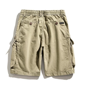 Outdoor khaki cargo shorts in durable cotton fabric with side flap pockets and elastic waist