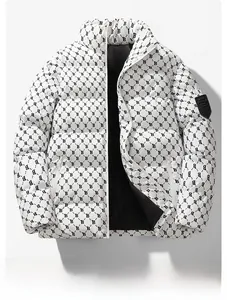 Detail of the high-density 'B' monogram print on a white winter puffer jacket with arm patch