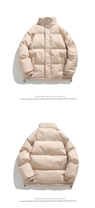 Detail view of beige padded puffer jacket showing stand collar and adjustable hem drawstring