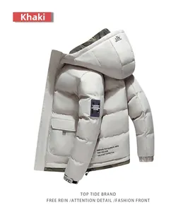 Detail view of khaki hooded parka with camouflage lining and 32K embroidery