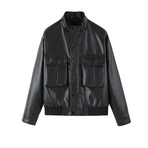 Detail view of black faux leather motorcycle jacket featuring snap buttons and cargo pockets