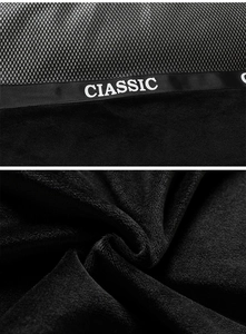 Detail of black velvet fabric texture with mesh splicing and CIASSIC lettered ribbon decoration