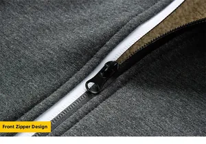 Detailed macro view of the sleek black zipper and fabric texture on a grey hoodie
