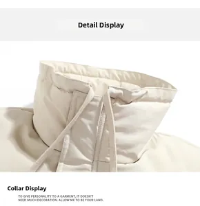 Detail view of the stand-up collar with adjustable drawstrings on a beige winter jacket