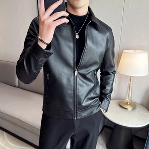 Detailed close-up of slim fit black faux leather jacket with zip pockets and lapel collar