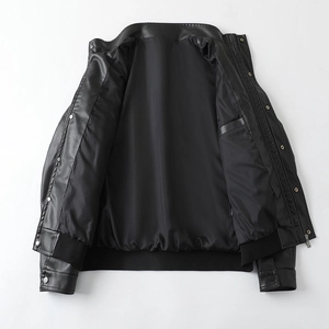 Detail view of men's PU leather jacket showing black polyester lining and inner pocket