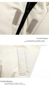 Detail of smooth black zipper and velcro closure on beige padded winter jacket