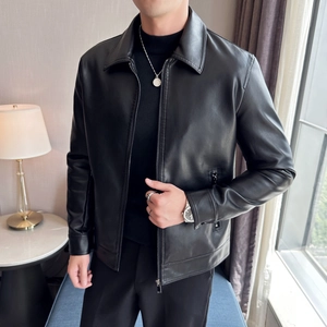 Close-up of black PU leather jacket showing classic lapel, zipper detail, and soft texture