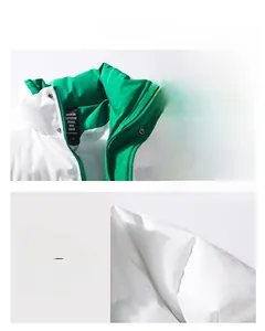 Detail view of stand-up collar and shoulder stitching on white and green jacket