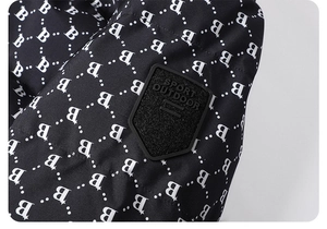 Detail of windproof puffer jacket fabric with B-letter prints and sports arm badge