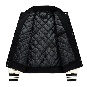Close-up of diamond quilted lining and striped ribbed cuffs on baseball jacket
