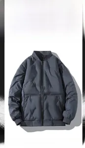 Detail of dark blue diamond-quilted bomber jacket with ribbed collar and cuffs