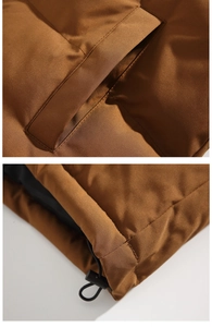 Detail view of brown puffer jacket showing stitched side pockets and adjustable drawstring hem