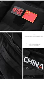 Detail of black winter parka featuring China flag patches and secure inner pockets