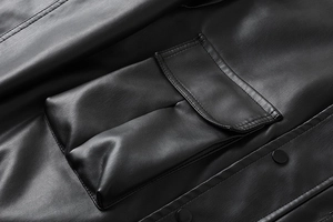 Detailed close-up of premium black PU leather jacket with a cargo pocket and metal snap button