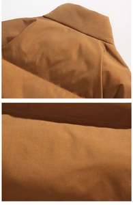 Detail of brown puffer jacket showing stand collar structure and horizontal quilting texture