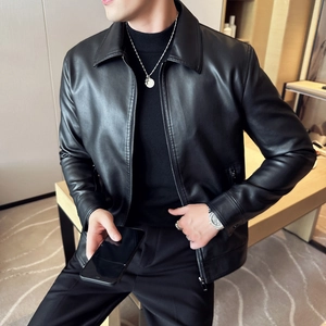 Detail of premium black PU leather jacket showing lapel and metal zipper texture