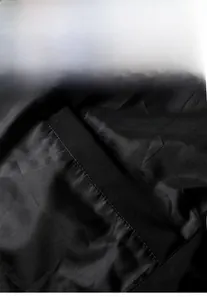 Detail view of high-density twill lining and internal pocket on men cotton jacket
