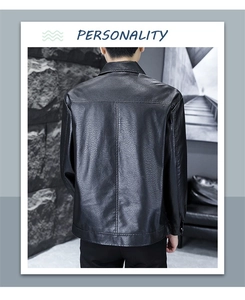 Detail of cross-stitched back seams on a black PU leather jacket with shirt collar
