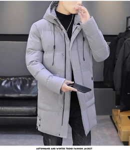 Detailed shot of light grey hooded parka with quilted design and black adjustable drawstrings