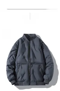 Detail showing wave-quilted navy blue jacket with ribbed cuffs and side snap pockets