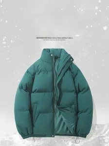 Detail of dark green winter puffer jacket with horizontal quilting and zipper closure