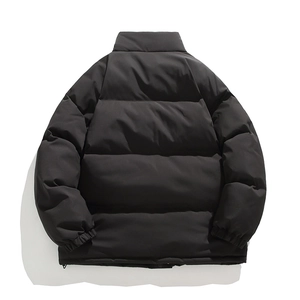 Back view of a black minimalist puffer jacket with stand collar and quilted design