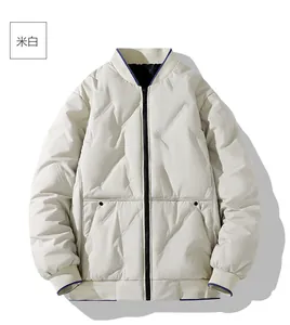 Flat lay of beige lightweight quilted jacket with navy contrast trim and baseball collar