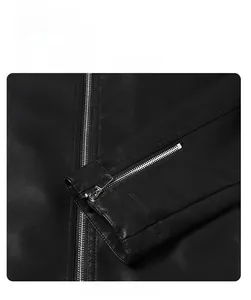 Close-up of black PU leather jacket cuff featuring functional silver metal zipper detail