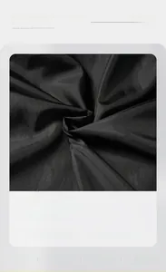 Detail of silky smooth black lining fabric for men's PU leather jacket, skin-friendly view