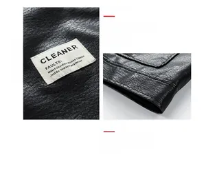 Detail view of black winter leather jacket featuring a CLEANER fabric label and smooth hem