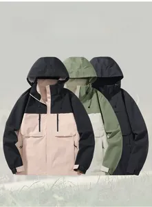 Waterproof windbreaker jackets in pink, green and black with a focus on hooded collar detail