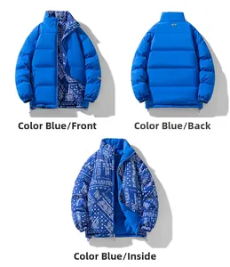 Detail view of double-sided quilted puffer jacket in solid blue and paisley print pattern