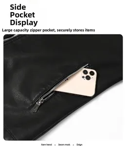 Close-up of black faux leather jacket featuring a large zippered pocket for smartphones