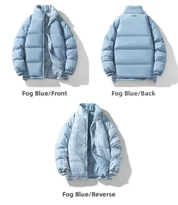 Detail view of fog blue reversible winter jacket with paisley pattern and stand collar
