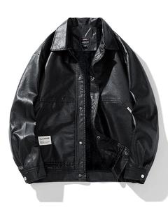 Close-up of minimalist black faux leather jacket with metal snap buttons and logo patch