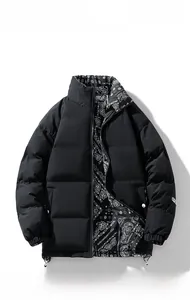 Detail of loose stand collar jacket showing black shell and paisley patterned lining