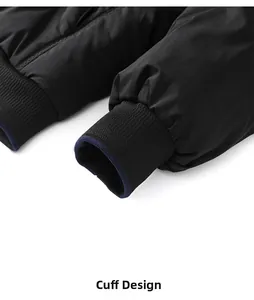 Close-up of ribbed knit cuffs on black winter jacket showing windproof elastic texture
