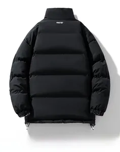 Detail view of windproof adjustable drawstring hem and elastic cuffs on black padded jacket