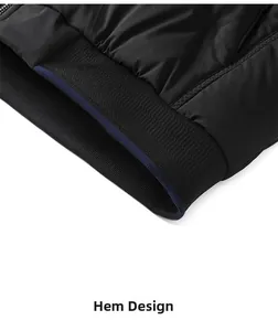 Detail view of black men jacket ribbed hem with a subtle navy blue decorative stripe