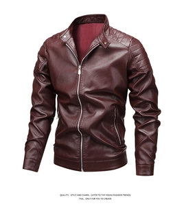 Detail view of burgundy faux leather jacket with ribbed shoulder padding and zip pockets