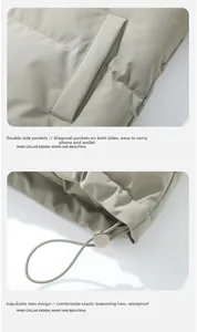 Detail view of windproof hem with adjustable drawstring and side pockets on a warm jacket